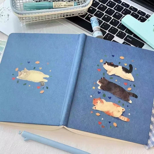 Cute notebook with blue cover and cats images